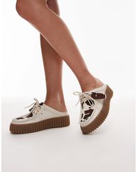 Clarks - – torhill – mules aus wildleder mit kuhfleckenmuster - Lyst