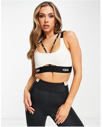 ASOS 4505 - Light Support Sports Bra With Skinny Branded Straps - Lyst