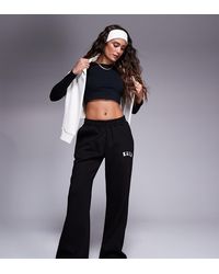 Kaiia - Petite Embroidered Logo Wide Leg Trackies - Lyst