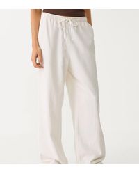 Stradivarius - Petite Flowing Trousers With Linen - Lyst