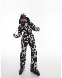 TOPSHOP - Sno Cow Print Ski Suit With Hood - Lyst