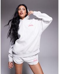 Kaiia - Sweat à capuche oversize d'ensemble avec logo imprimé en relief - clair chiné et rose pastel - Lyst