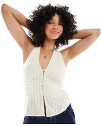 Stradivarius - Top Allacciato Al Collo Color Crema Con Motivo Gessato E Bottoni - Lyst