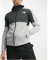 The North Face - Training mountain athletic - sweat à capuche zippé en polaire - noir et gris - Lyst