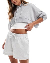 New Balance - Sport essentials - short en tissu éponge - Lyst