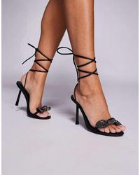Public Desire - Sandalias Negras De Tacón Con Detalle De Lazo Y Diseño Anudado A La Pierna Rose De - Lyst