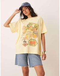 ASOS - Camiseta Amarilla Extragrande Con Estampado Gráfico De Sellos De - Lyst