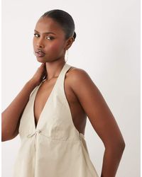 Y.A.S - Plunge Halter Neck Peplum Hem Top With Bow Trim - Lyst