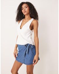 ASOS - Denim Wrap Front Mini Skirt With Bow Detail - Lyst