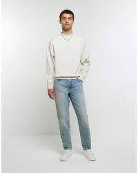 River Island - Tapered Fit Faded Jeans - Lyst