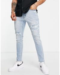 Hollister Skinny Jeans Met Gerepareerde Slijtages En Lichte Wassing - Blauw