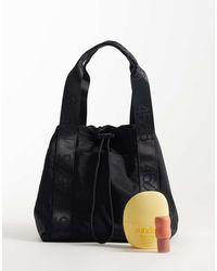 4505 - Woven Adjustable Drawstring Bucket Bag With External Pocket - Lyst