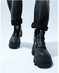 ASOS - Botas negras con cordones, suela gruesa y detalle - Lyst