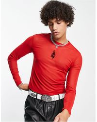 ASOS - Maglietta a maniche lunghe attillata taglio corto rossa con stampa dévoré nera - Lyst