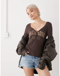 Monki - Long Sleeve Henley Button Top With Flared Sleeves And Yellow Varsity Print - Lyst