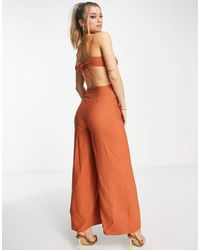 ASOS - Mono Largo Con Lazada En La Espalda Y Botones Laterales De Tejido Efecto Lino De -Rojo - Lyst