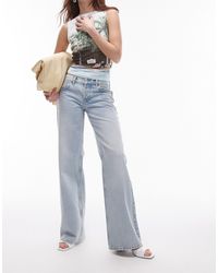TOPSHOP - Ember - jeans a vita bassa con fondo ampio candeggiati - Lyst