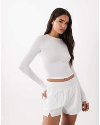 4505 - Lightweight Active Ruched Front Long Sleeve Running Top - Lyst