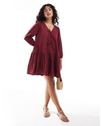 esmé studios - Esmee Exclusive Linen Mix Long Sleeve Tiered Mini Tie Front Beach Dress - Lyst