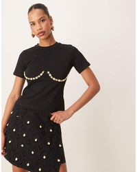Never Fully Dressed - Camiseta Negra Con Diseño Encogido Y Ribetes Bajo El Pecho De Conchas De (Parte De Un Conjunto) - Lyst