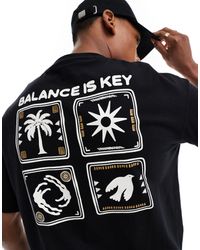 SELECTED - T-shirt oversize nera con stampa "balance" con palme sul retro - Lyst