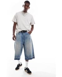 Pull&Bear - Bermuda ultra baggy en jean à ourlet brut - moyen - Lyst