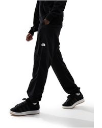 The North Face - Nylon Woven Loose Fit joggers - Lyst