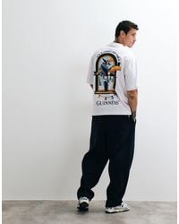 ASOS - Oversized T-shirt With Guinness Christmas Print - Lyst