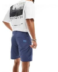 adidas Originals - Pantalones Cortos Chinos Azul Marino De -Negro - Lyst