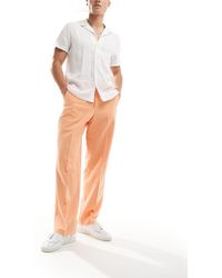 ASOS - Pantaloni eleganti a fondo ampio arancioni - Lyst