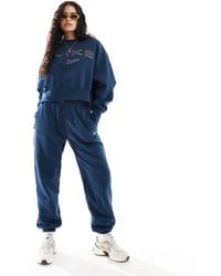 nike plus mini swoosh oversized jogger in navy
