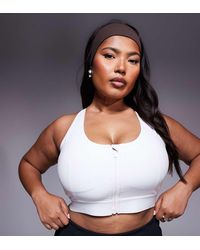 4505 - Curve Icon High Support Zip Front Sports Bra With Adjustable Straps And Removable Padding - Lyst