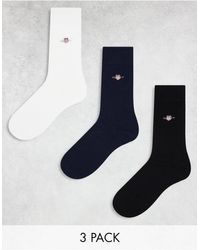 GANT - Confezione da 3 paia di calzini neri, bianchi e blu navy con logo - Lyst