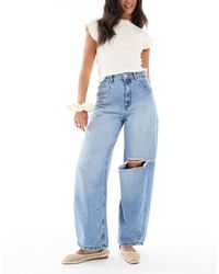 ASOS - Jean ample à taille haute et genou déchiré - délavage moyen doux - Lyst