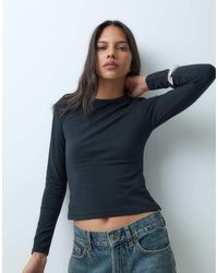 Abercrombie & Fitch - Seamless Long Sleeve Baby Tee - Lyst