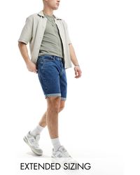 ASOS - Short en jean coupe slim classique stretch - moyen délavé - Lyst