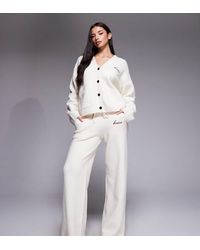 Kaiia - Wool Feel Knitted Embroidered Logo Wide Leg Pants - Lyst