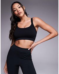 4505 - Fuller Bust Sculpting Seamless Medium Support Sports Bra - Lyst