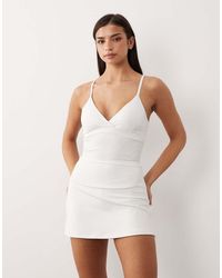 4505 - Active Tennis Skirt With Under Shorts And Phone Pocket - Lyst
