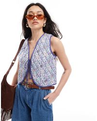 ASOS - Veste sans manches matelassée avec imprimé fleuri et liens noués à l'avant - Lyst