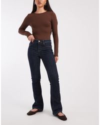Vero Moda - Flash Mid Rise Flare Jeans - Lyst