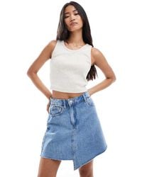 Pieces - Asymmetric Hem Detail Denim Mini Skirt - Lyst