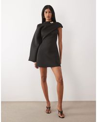 asos design mini dress with long sleeve and circle trim ASOS DESIGN mini dress with long sleeve and circle trim