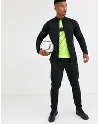 black and green puma tracksuit