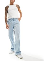 ASOS - Jeans larghi con fondo ampio e allacciatura lavaggio power - Lyst