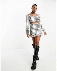 ASOS - Mini-jupe d'ensemble en bouclé à carreaux et détail frangé - noir et blanc - Lyst