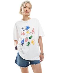 Vero Moda - T-Shirt Bianca Oversize Stile Boyfriend Con Grafica Di Cibo Estivo - Lyst