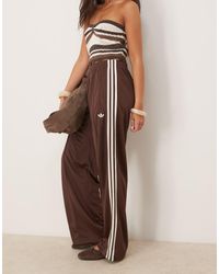 adidas Originals - Pantalones De Chándal Marrones De Corte Suelto Firebird De -Marrón - Lyst