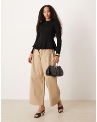 Mango - Ribbed Knitted Top With Peplum Hem - Lyst