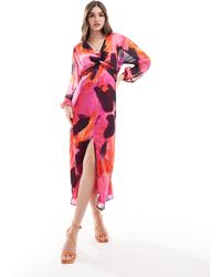 ASOS - Robe mi-longue transparente nouée devant à imprimé abstrait - rose - Lyst